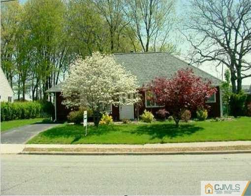 8 Stiles Road Edison, NJ 08817 - Photo 1 of 1 a view of a yard with plants and trees