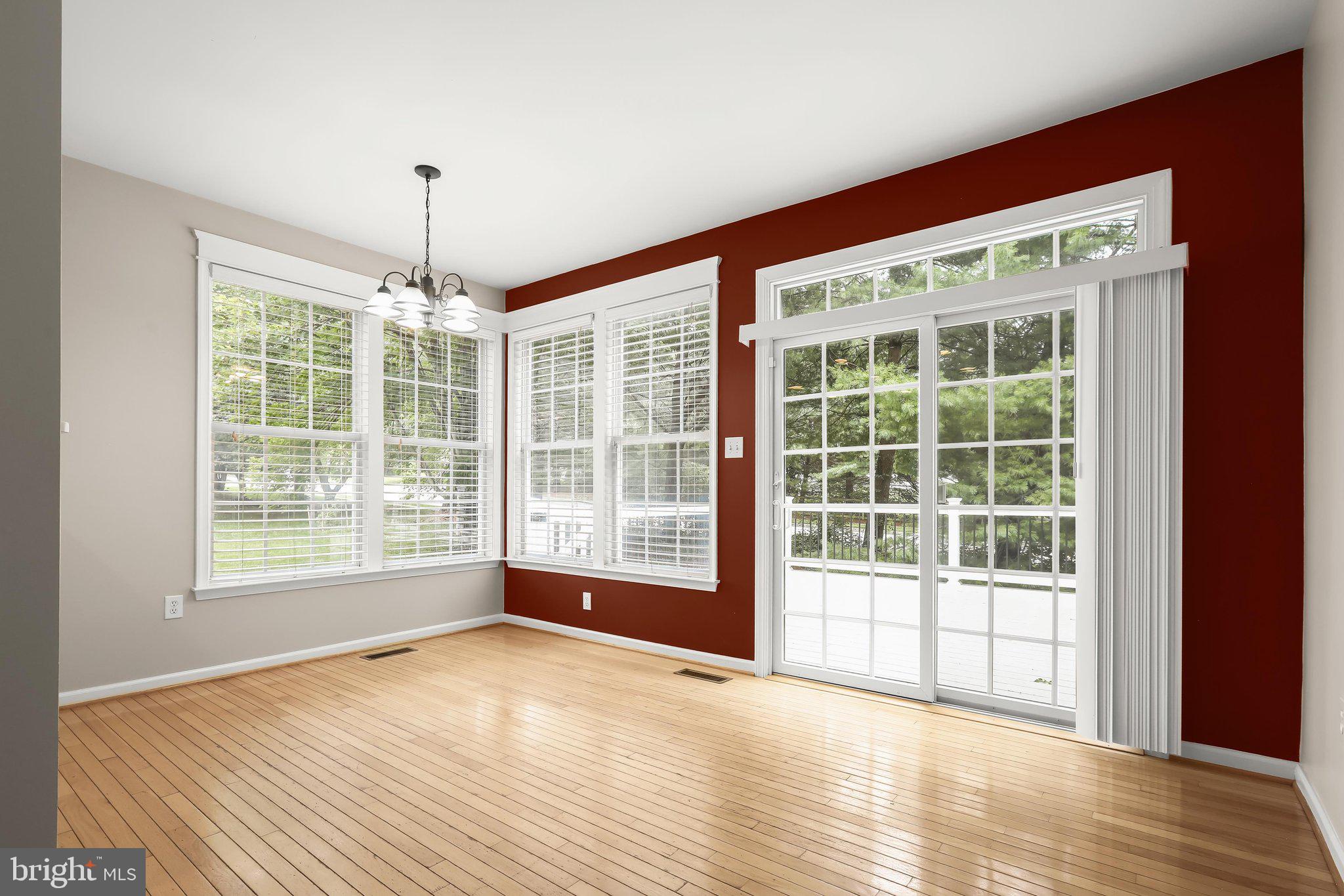 6111 Rippling Tides Terrace Clarksville, MD 21029 - Photo 28 of 84 a view of empty room with wooden floor and fan