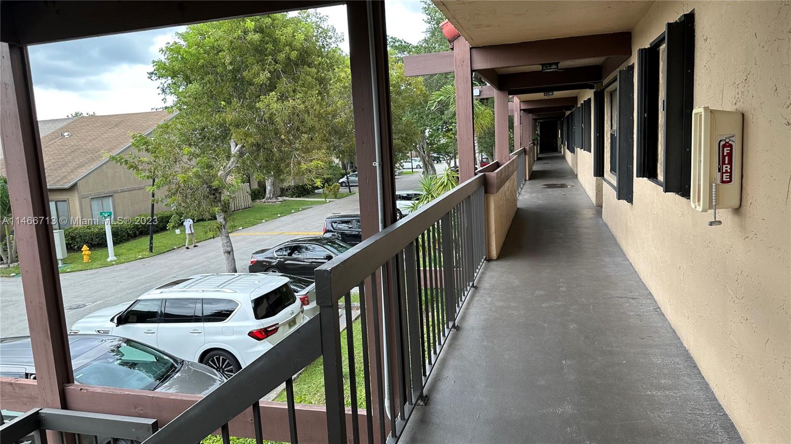 a view of a balcony and yard