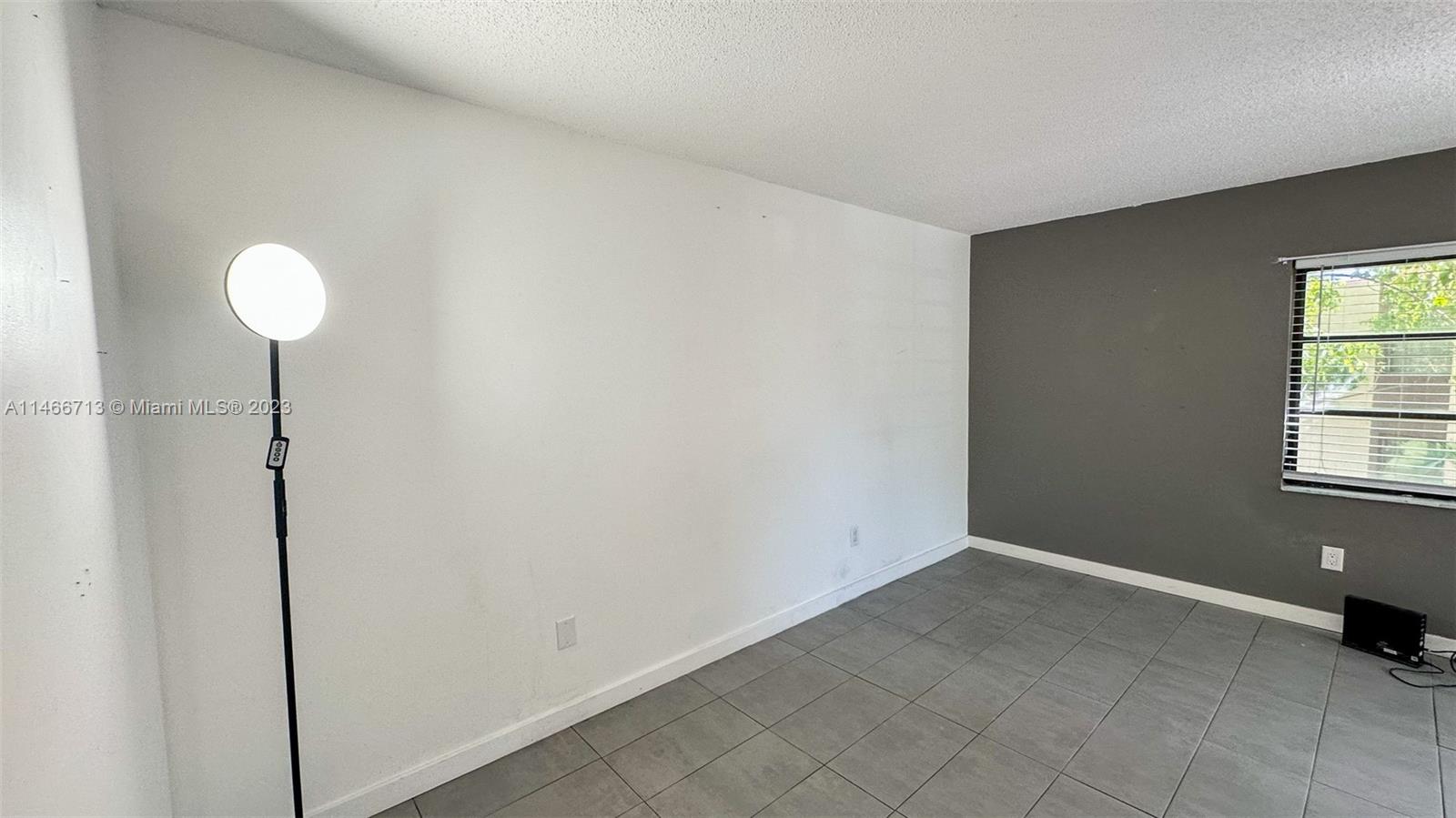 California Club Miami, FL 33179 - Photo 11 of 40 a view of an empty room with a window