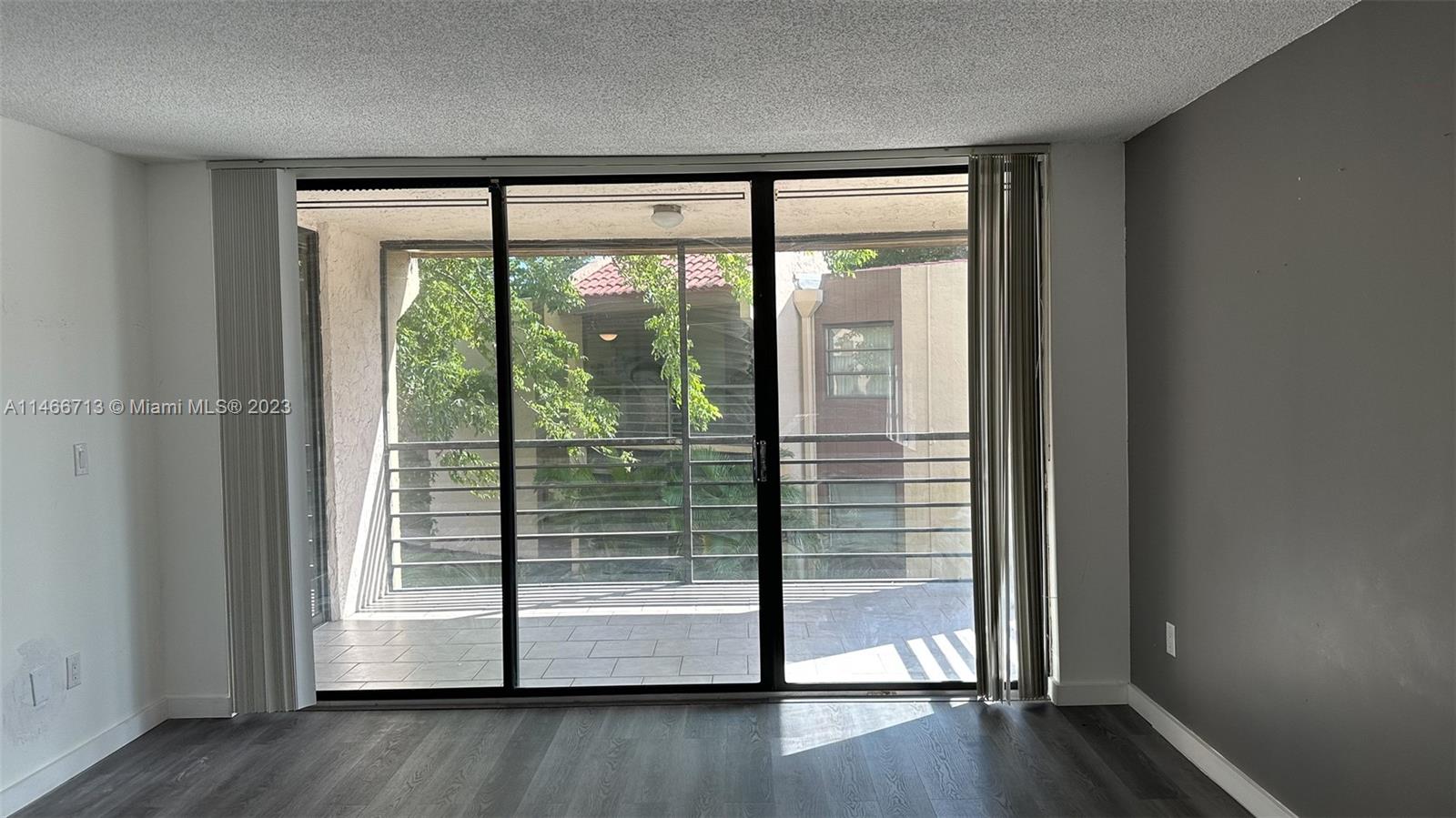California Club Miami, FL 33179 - Photo 15 of 40 a view of empty room with wooden floor and fan
