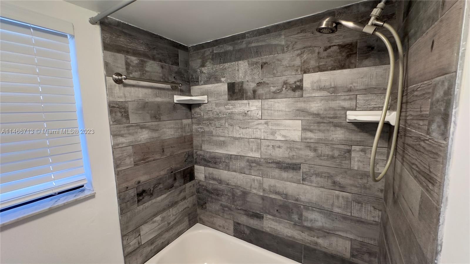 California Club Miami, FL 33179 - Photo 21 of 40 a bathroom with a shower and toilet