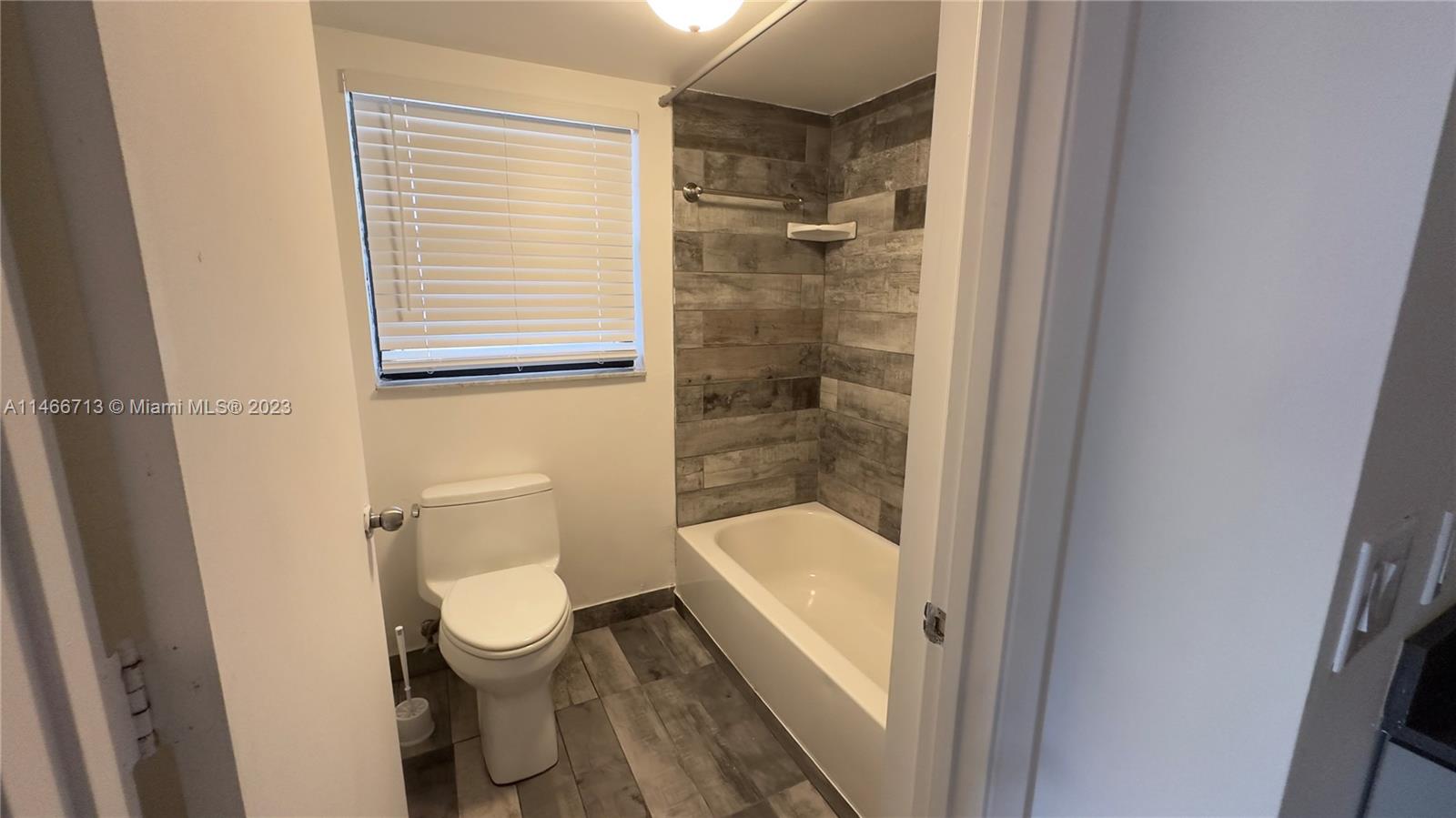 California Club Miami, FL 33179 - Photo 23 of 40 a bathroom with a toilet and a shower