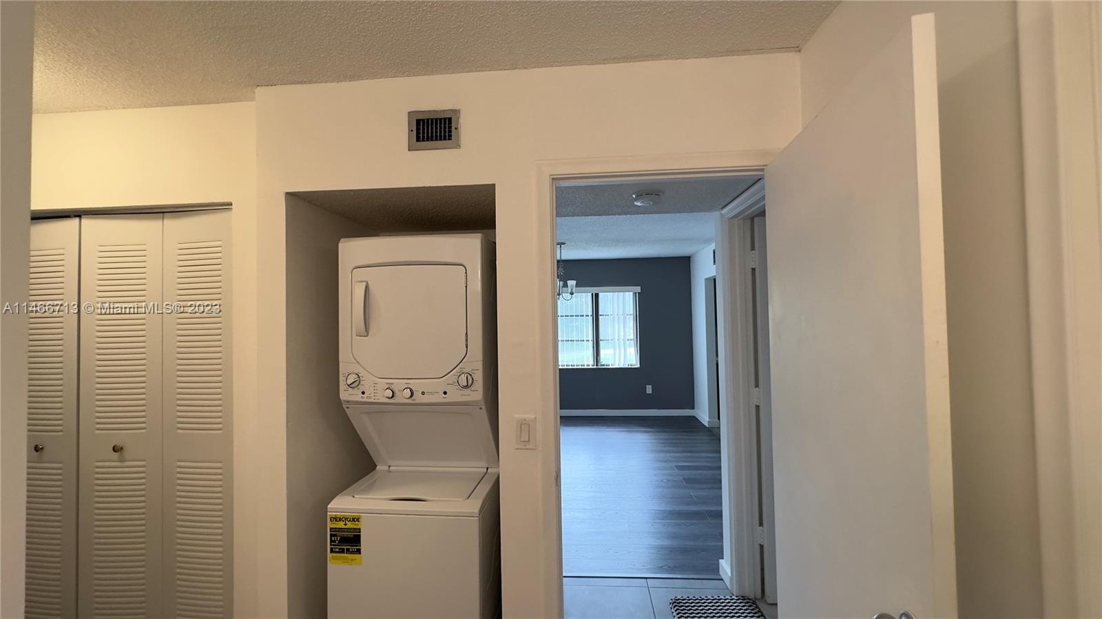 California Club Miami, FL 33179 - Photo 33 of 40 a view of a hallway with wooden floor and a hallway