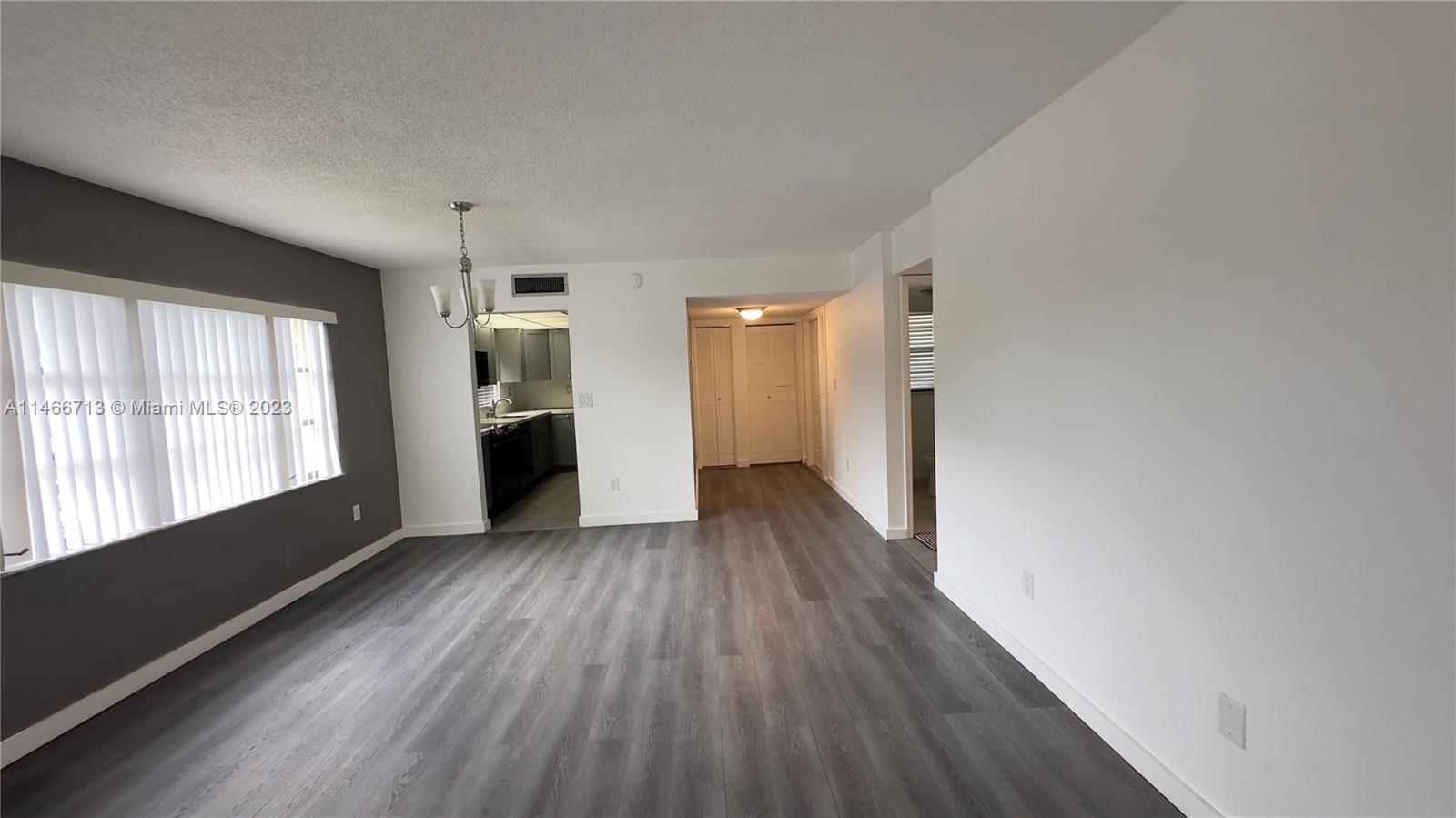 California Club Miami, FL 33179 - Photo 38 of 40 a view of a room with wooden floor and windows