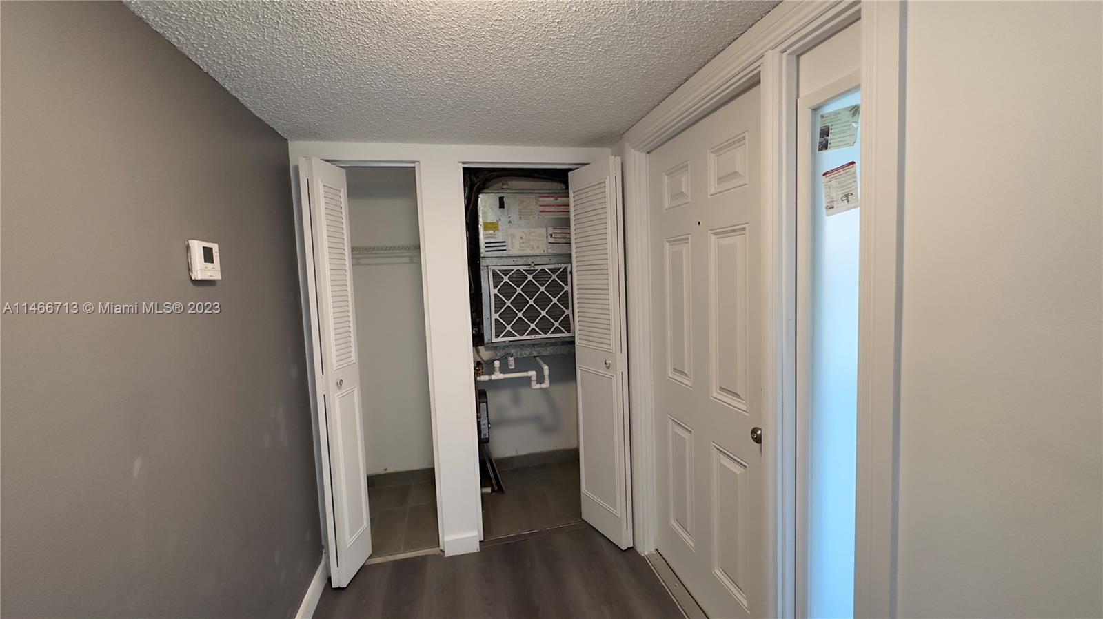 California Club Miami, FL 33179 - Photo 39 of 40 a view of a hallway with wooden floor and closet
