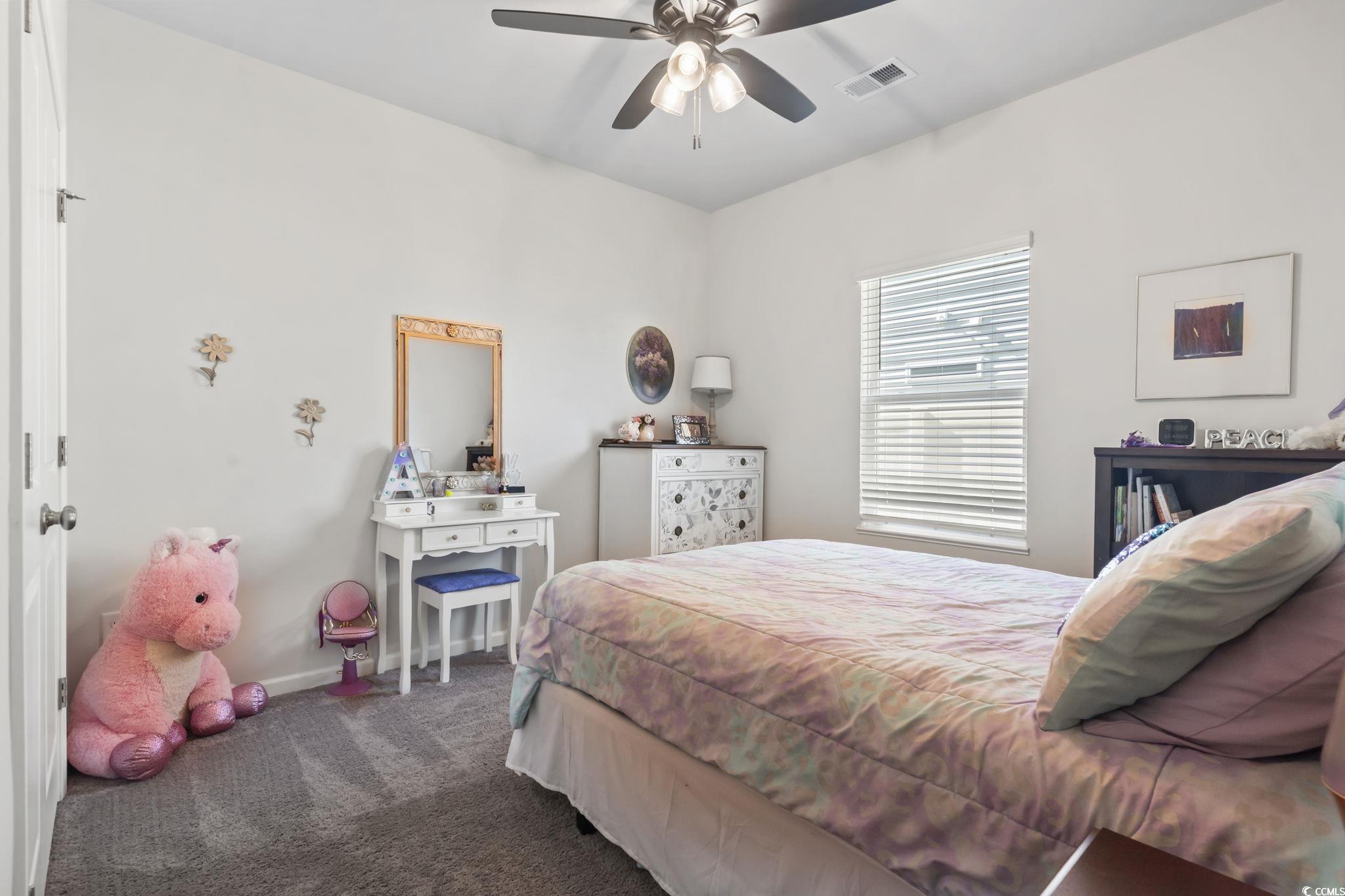 1310 Boswell Court Conway, SC 29526 - Photo 12 of 35 Carpeted bedroom with ceiling fan and baseboards