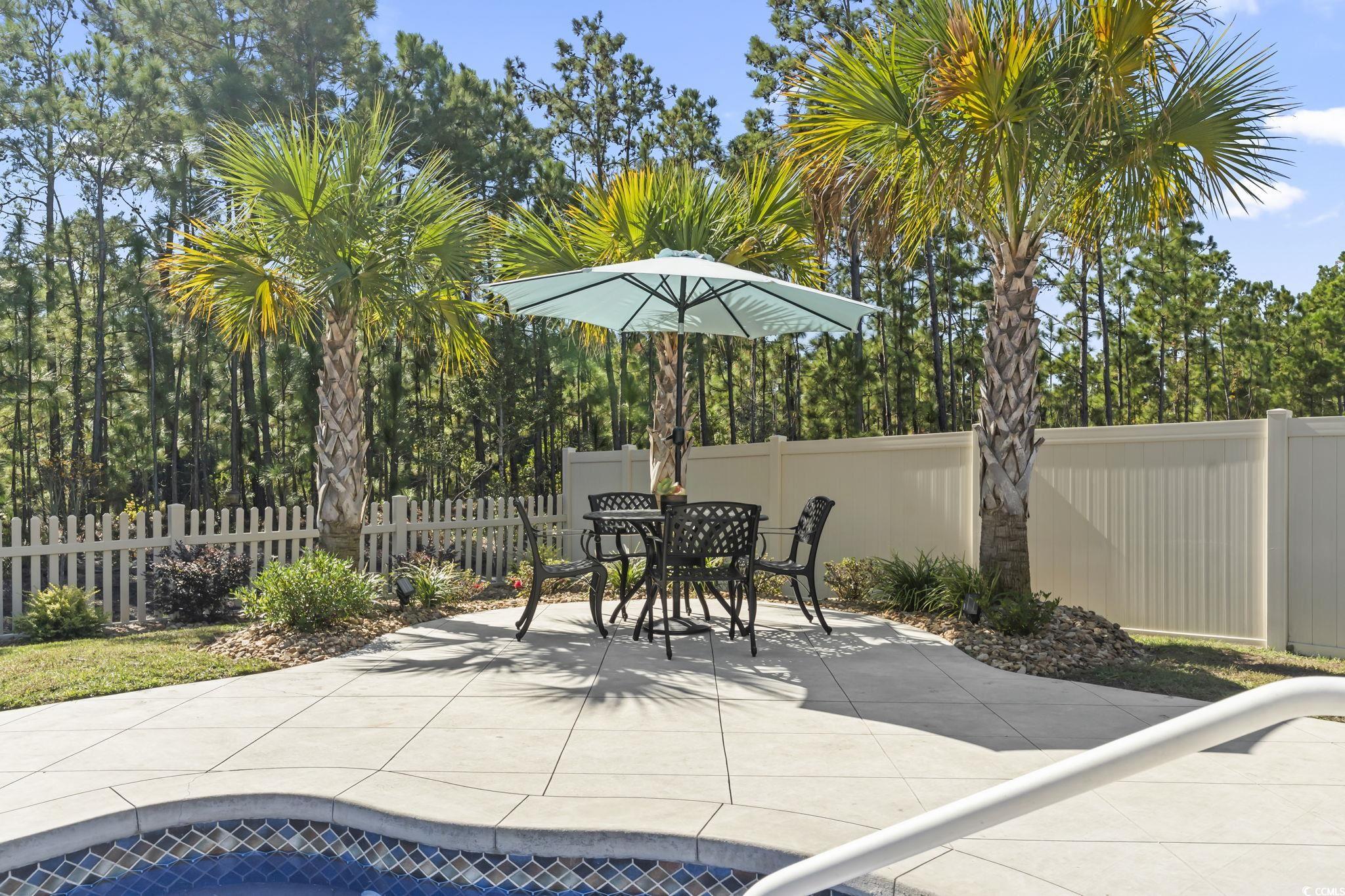 1310 Boswell Court Conway, SC 29526 - Photo 25 of 35 Fenced backyard featuring a patio and outdoor dining area