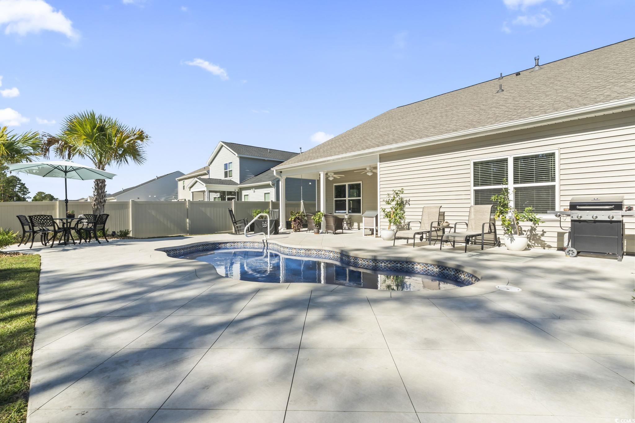 1310 Boswell Court Conway, SC 29526 - Photo 26 of 35 View of swimming pool featuring a patio area, ceiling fan, a fenced backyard, and grilling area