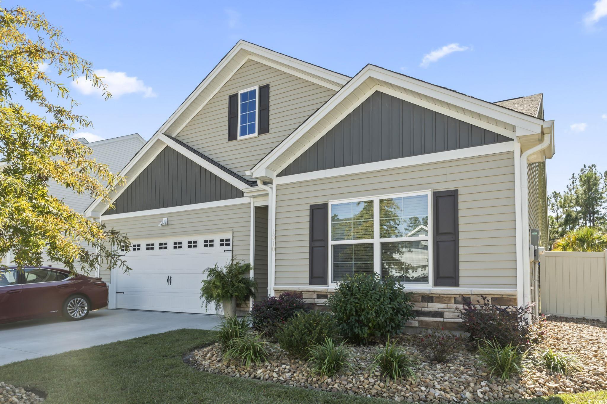 1310 Boswell Court Conway, SC 29526 - Photo 35 of 35 View of front of property featuring stone siding, a garage, and concrete driveway
