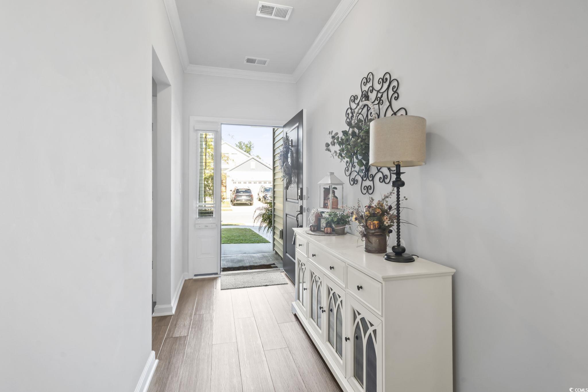 1310 Boswell Court Conway, SC 29526 - Photo 6 of 35 Doorway with ornamental molding and wood finished floors