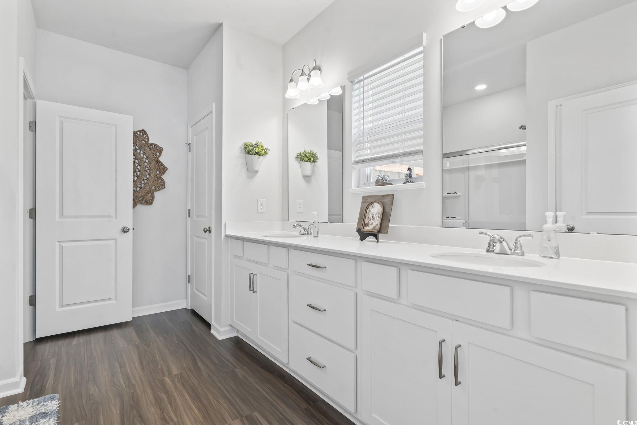 1310 Boswell Court Conway, SC 29526 - Photo 10 of 35 Full bathroom featuring double vanity and dark wood-style floors