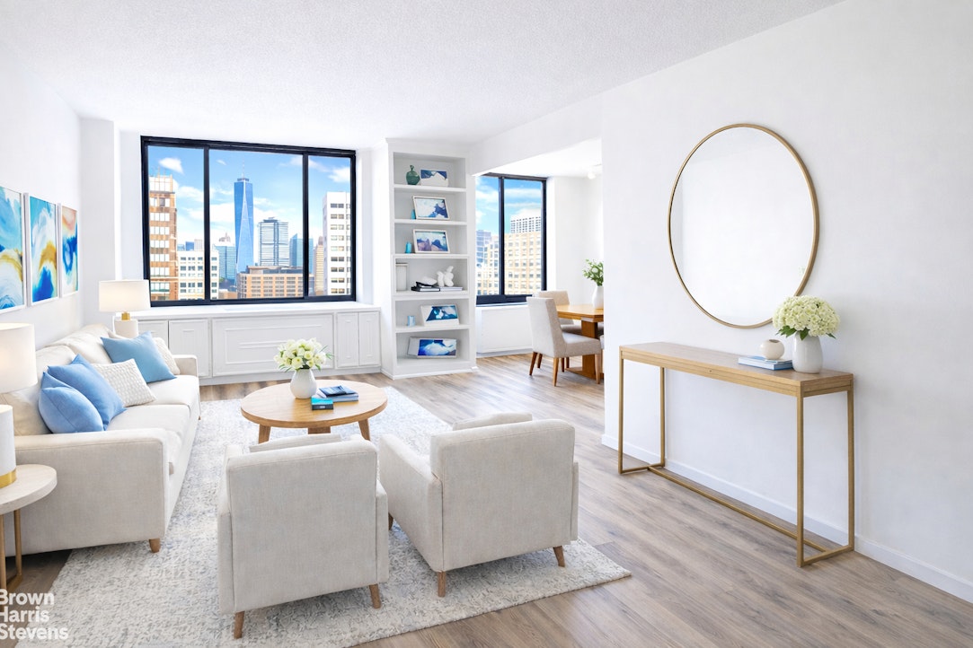 a living room with furniture a wooden floor and a large window