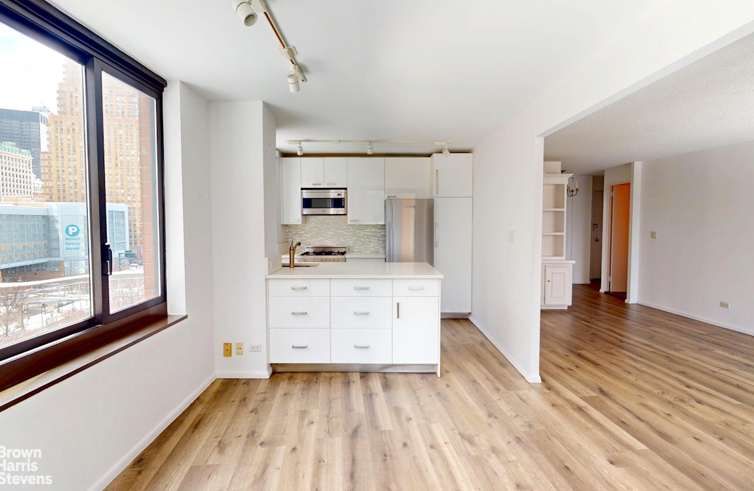 200 Rector Place, Unit 8U Manhattan, NY 10280 - Photo 11 of 25 a view of kitchen with wooden floor