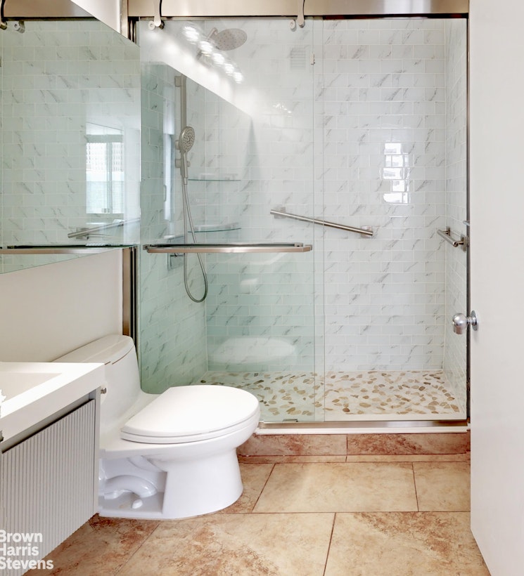 200 Rector Place, Unit 8U Manhattan, NY 10280 - Photo 18 of 25 a bathroom with a toilet and a shower