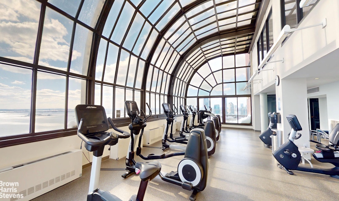 200 Rector Place, Unit 8U Manhattan, NY 10280 - Photo 21 of 25 a view of a room with gym equipment