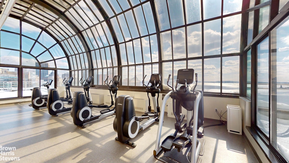 200 Rector Place, Unit 8U Manhattan, NY 10280 - Photo 22 of 25 a view of a room with gym equipment