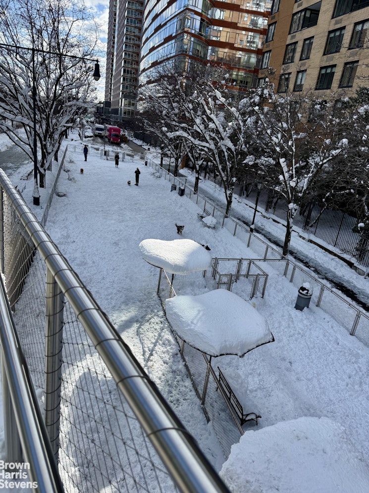 200 Rector Place, Unit 8U Manhattan, NY 10280 - Photo 24 of 25 a terrace with outdoor seating and trees