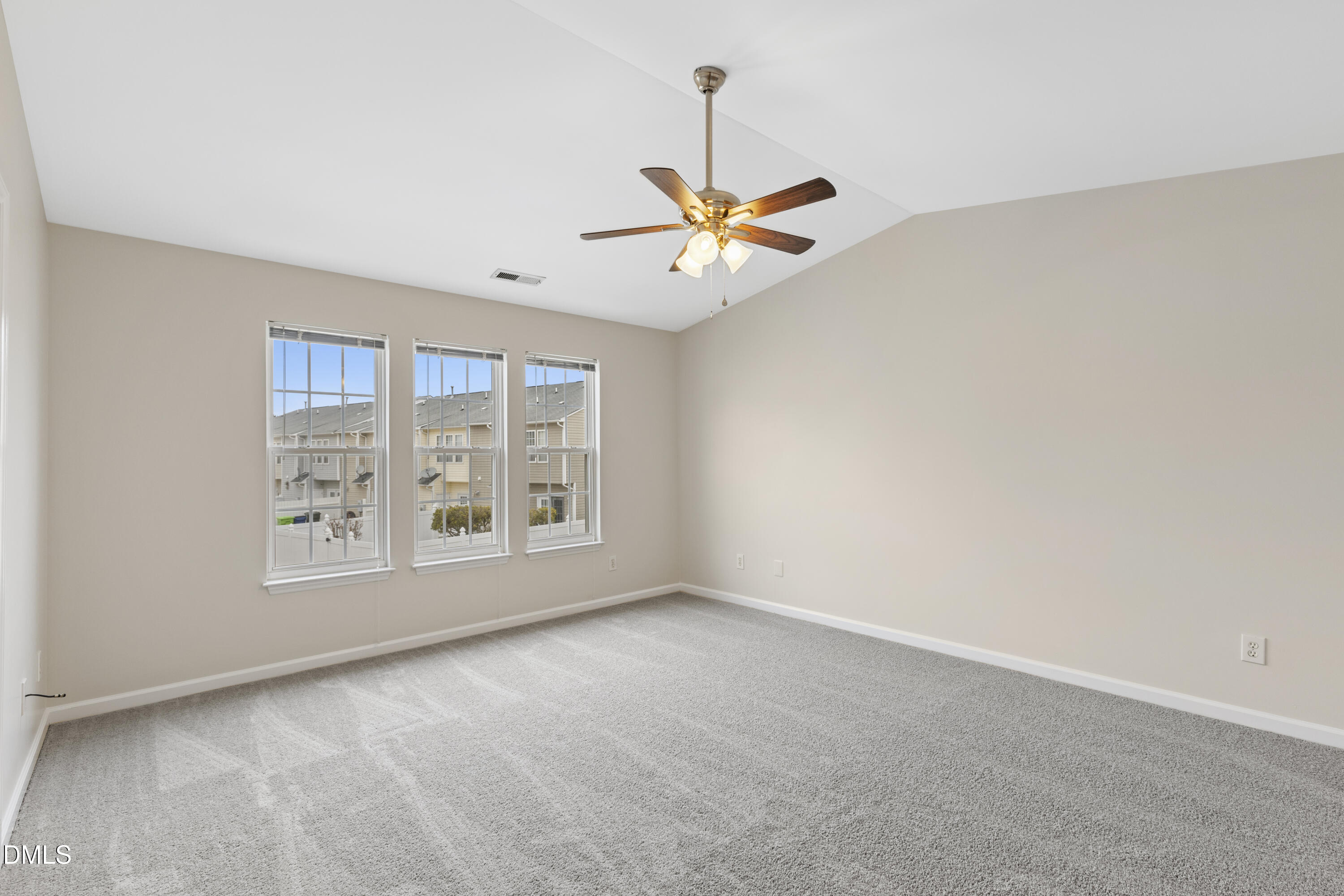 6013 San Marcos Way Raleigh, NC 27616 - Photo 12 of 21 an empty room with windows and fan