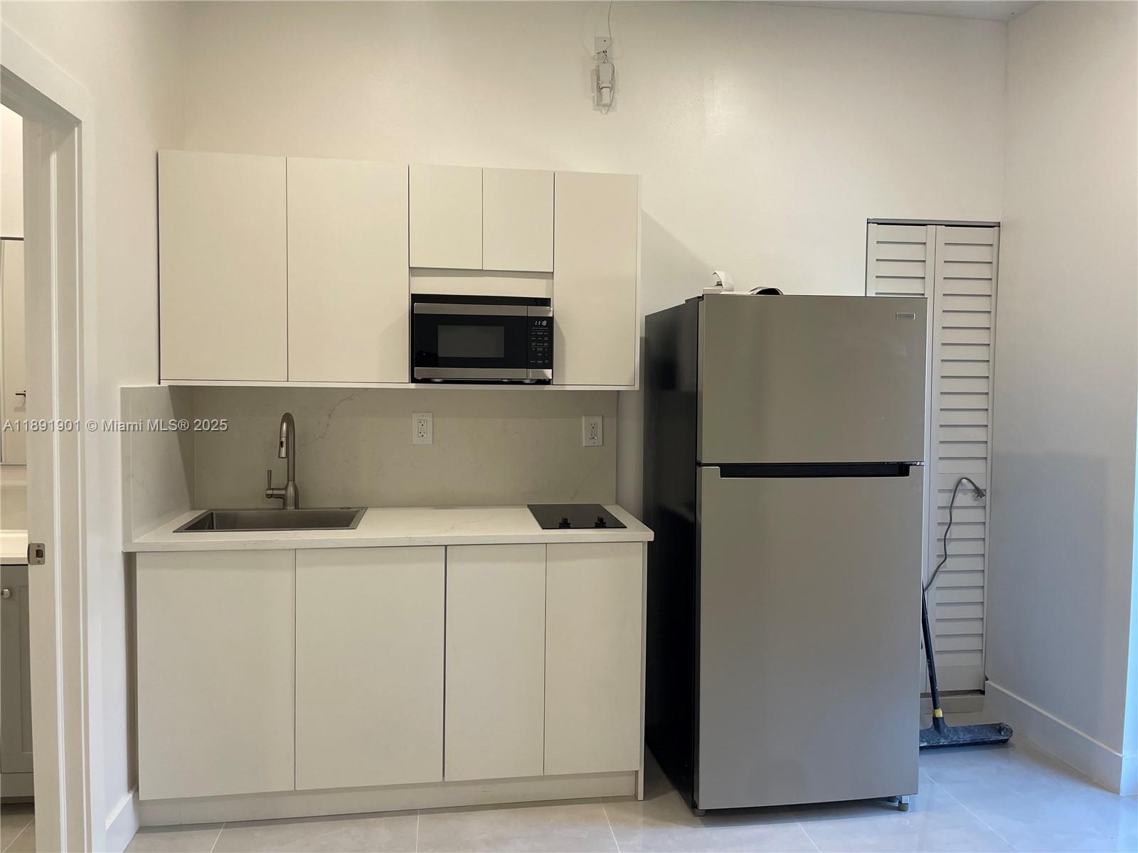30778 Southwest 192nd Avenue, Unit 1 Homestead, FL 33030 - Photo 4 of 10 a utility room with washer and dryer