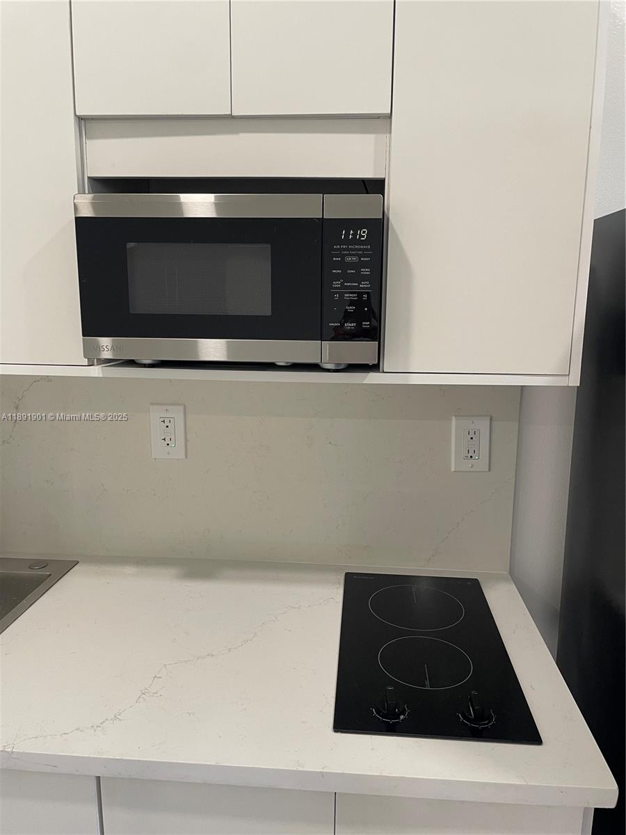 30778 Southwest 192nd Avenue, Unit 1 Homestead, FL 33030 - Photo 6 of 10 a view of washer and dryer