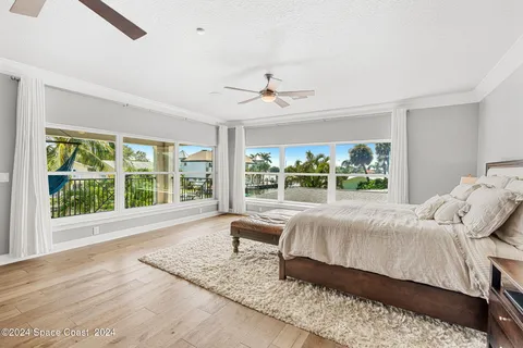 a view of a house with swimming pool and sitting area