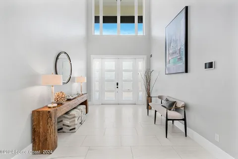 a living room with furniture wooden floor and a table