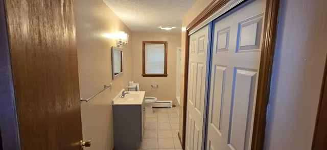 a bathroom with a mirror and a sink