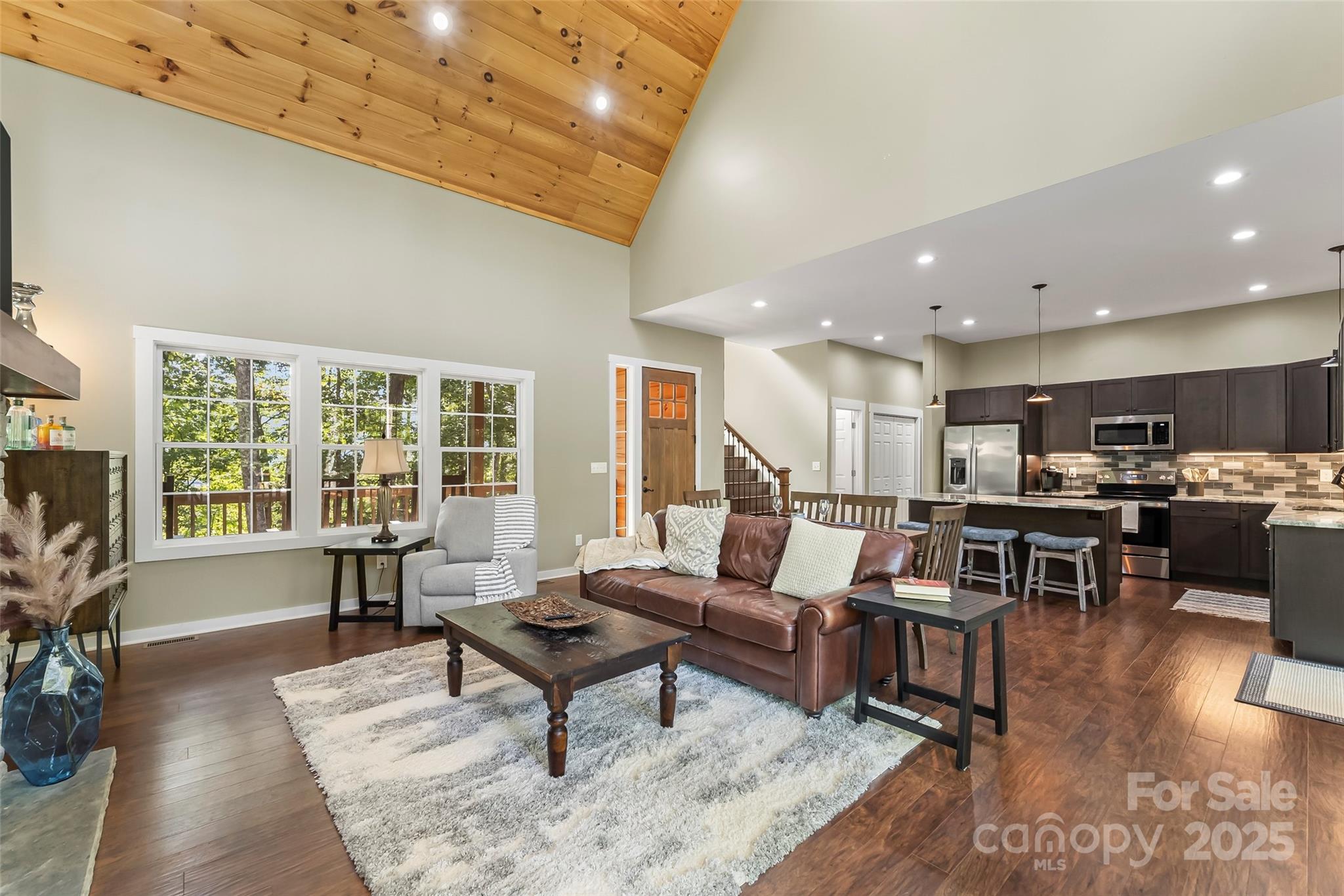 90 Clinchfield Gap Road Marion, NC 28752 - Photo 14 of 42 a living room with furniture dining table and a large window