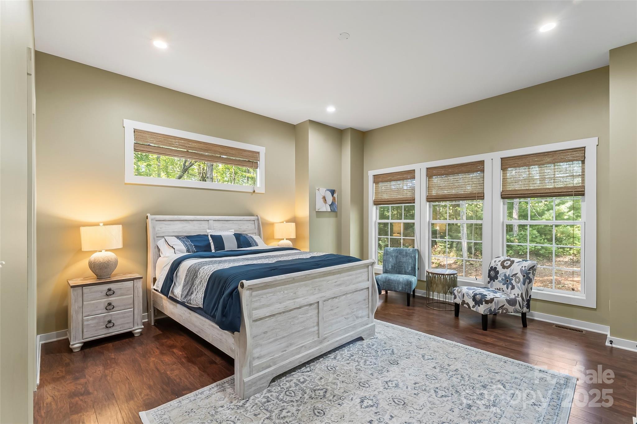 90 Clinchfield Gap Road Marion, NC 28752 - Photo 17 of 42 a bed room with a bed and a chair