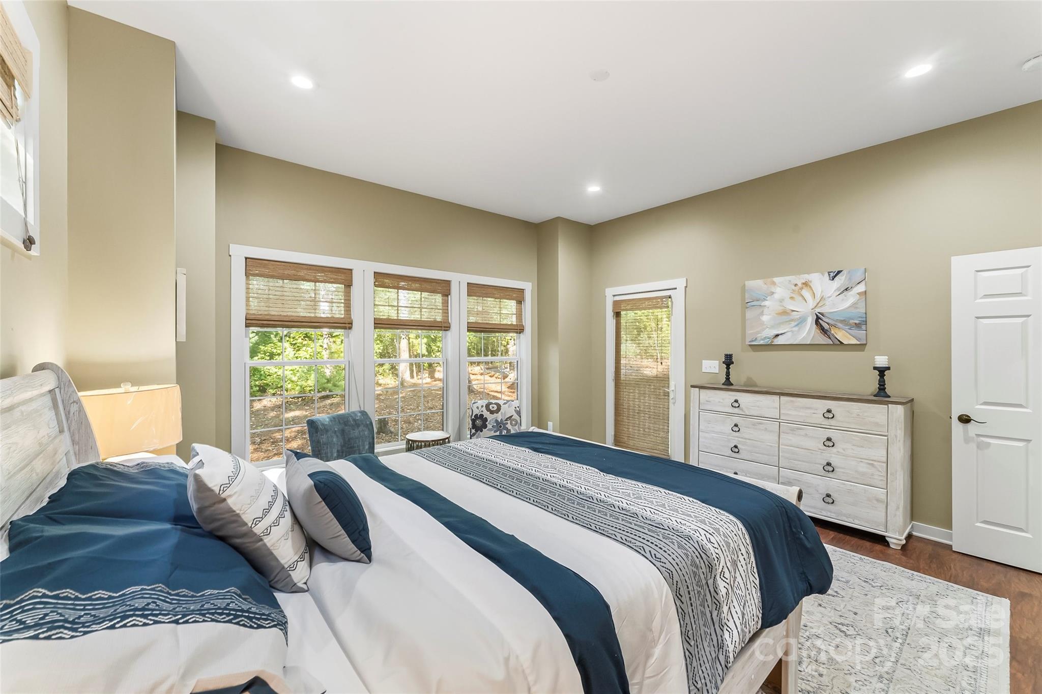 90 Clinchfield Gap Road Marion, NC 28752 - Photo 19 of 42 a bedroom with a bed and large windows