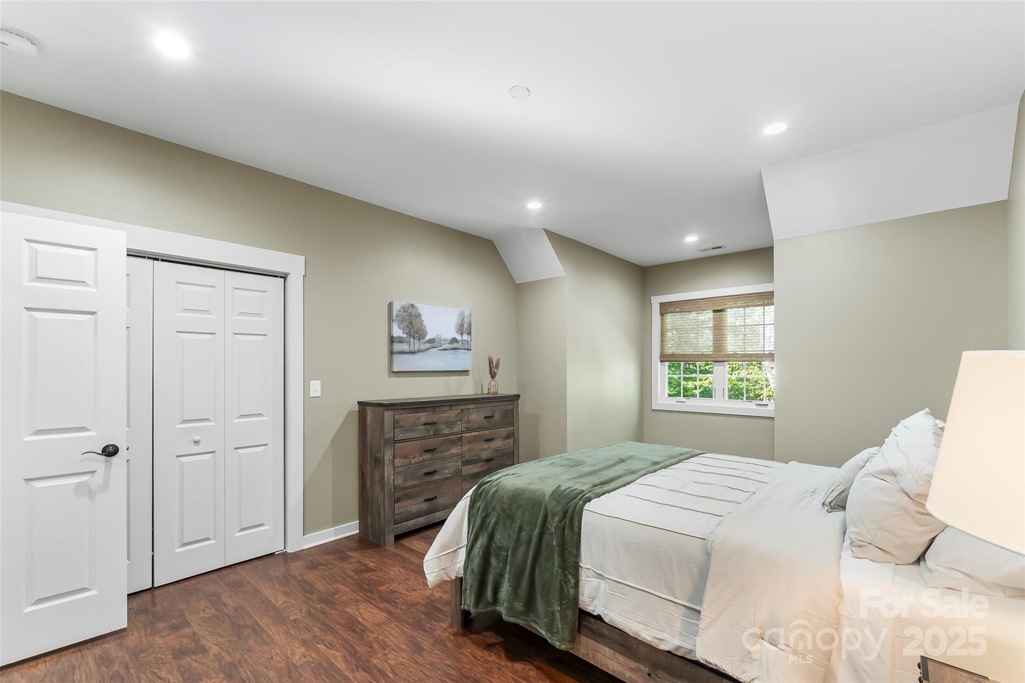 90 Clinchfield Gap Road Marion, NC 28752 - Photo 25 of 42 a bedroom with a bed and a dresser