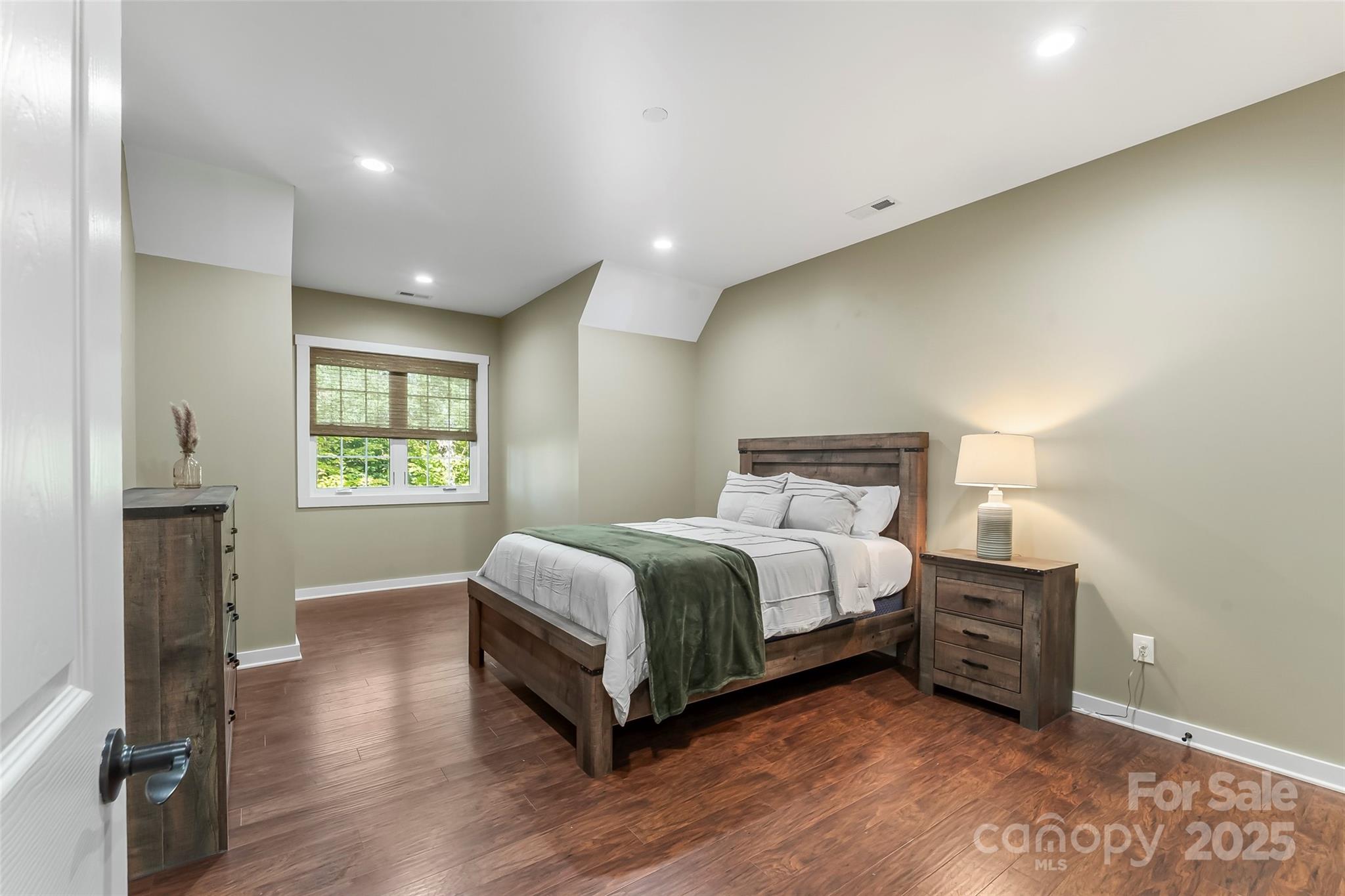 90 Clinchfield Gap Road Marion, NC 28752 - Photo 26 of 42 a bedroom with a bed and a tv