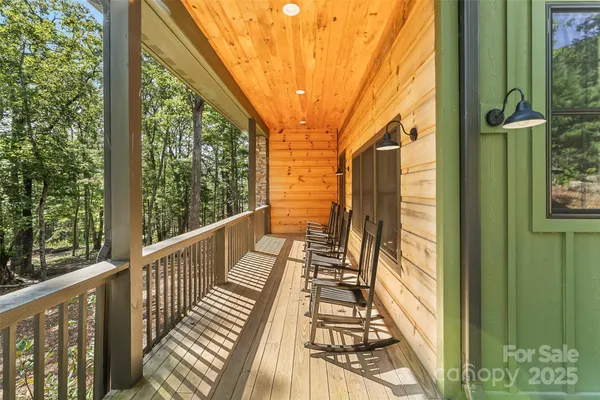 a view of balcony with wooden floor