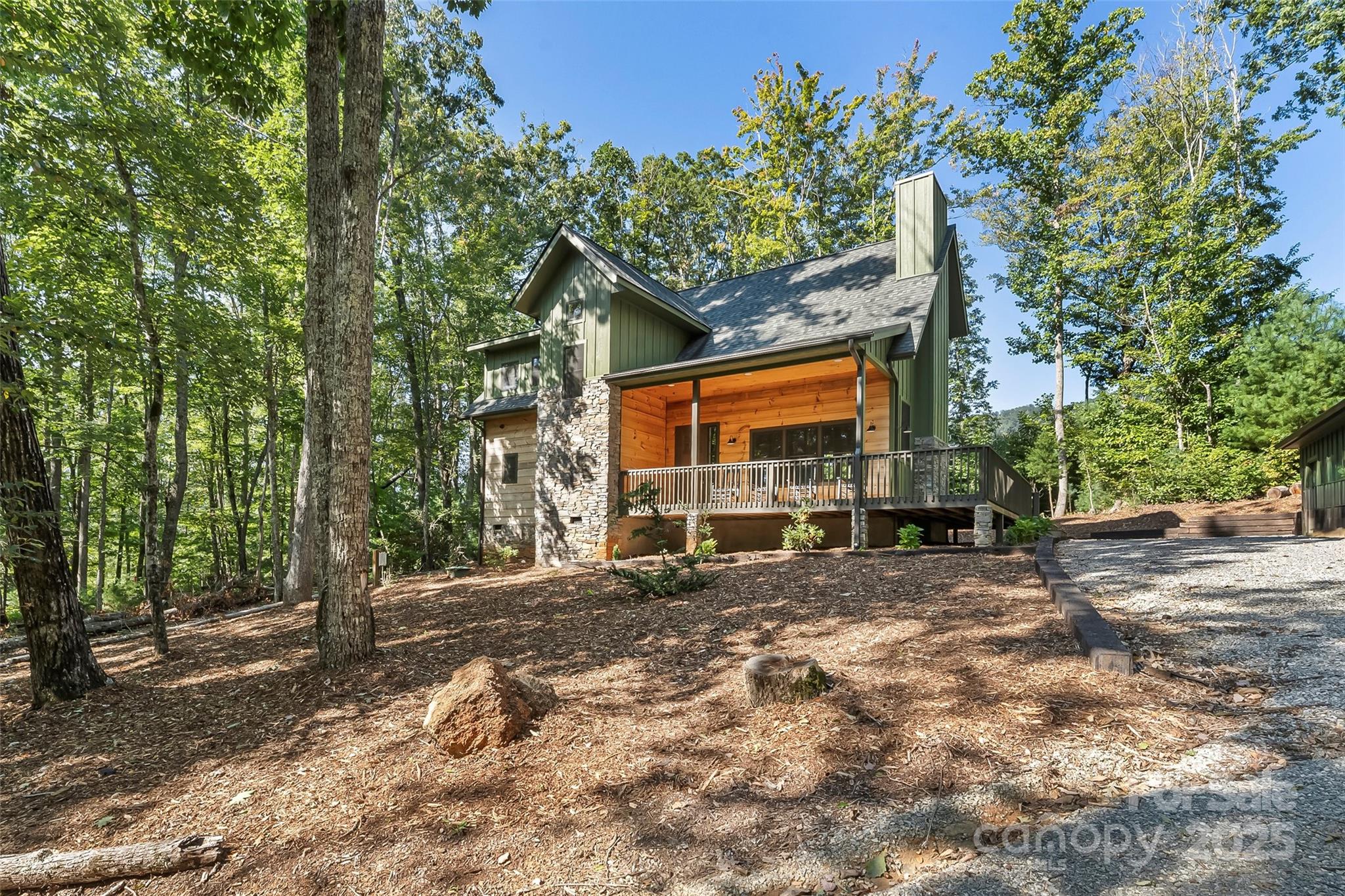 90 Clinchfield Gap Road Marion, NC 28752 - Photo 4 of 42 a view of a house with a tree in the background