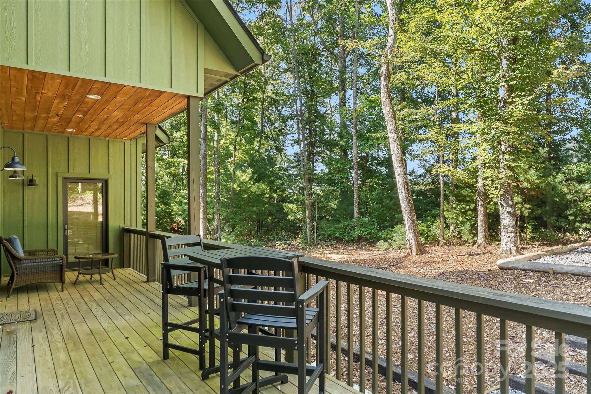 90 Clinchfield Gap Road Marion, NC 28752 - Photo 8 of 42 a view of a patio with table and chairs under an umbrella