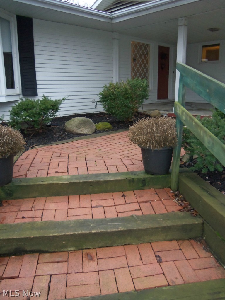 7371 Button Road Mentor, OH 44060 - Photo 2 of 25 FOLLOW THE RED BRICK PATH TO THE FRONT DOOR OF THIS TRULY UNIQUE HOME.