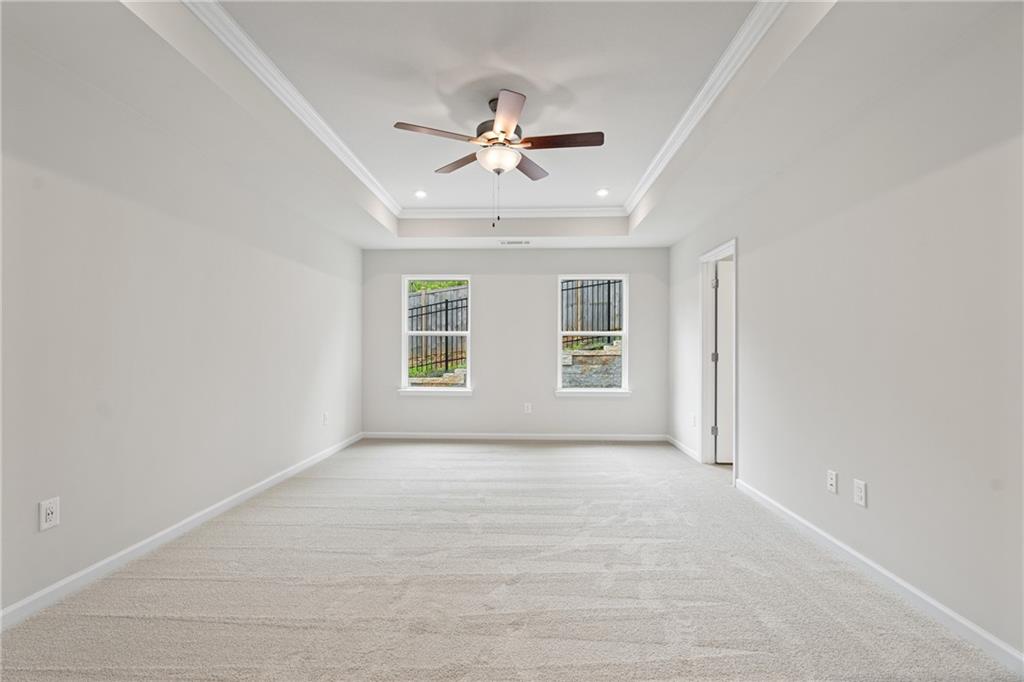 710 Smokey Quartz Way Kennesaw, GA 30144 - Photo 22 of 31 an empty room with windows and fan