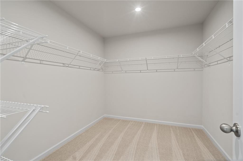 710 Smokey Quartz Way Kennesaw, GA 30144 - Photo 24 of 31 a view of a room with racks on the wall