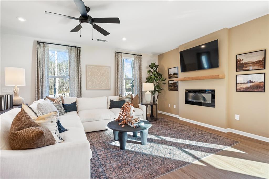 710 Smokey Quartz Way Kennesaw, GA 30144 - Photo 45 of 76 a living room with furniture and a flat screen tv
