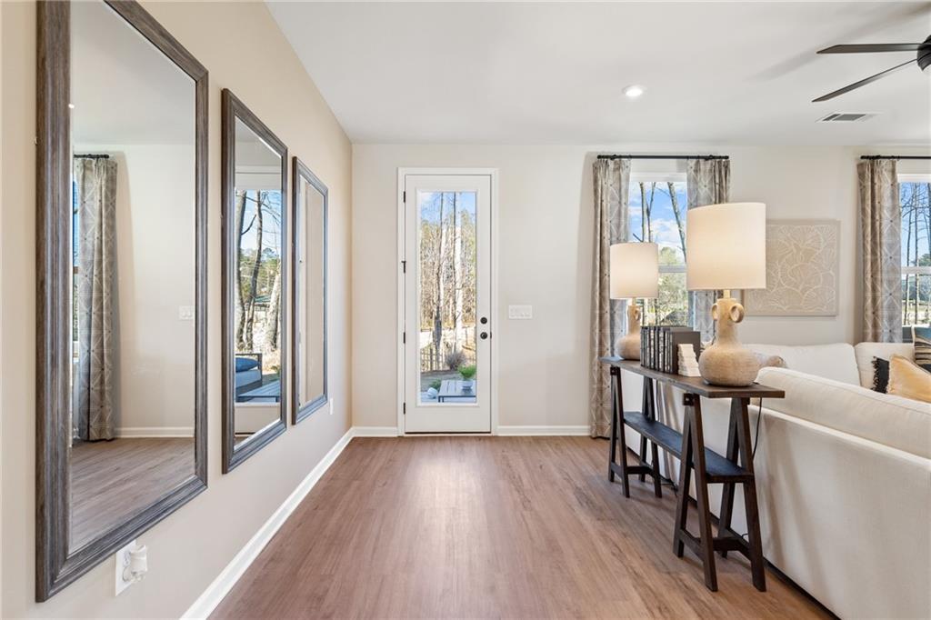 710 Smokey Quartz Way Kennesaw, GA 30144 - Photo 50 of 76 a view of a livingroom with furniture and hardwood floor