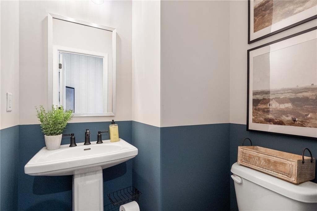 710 Smokey Quartz Way Kennesaw, GA 30144 - Photo 58 of 76 a bathroom with a sink and a toilet