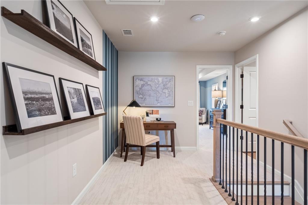 710 Smokey Quartz Way Kennesaw, GA 30144 - Photo 61 of 76 a view of a hallway with seating area
