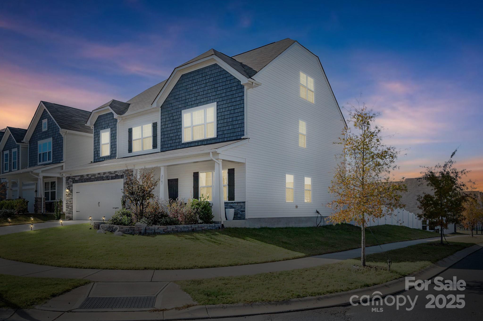 a front view of a house with garden