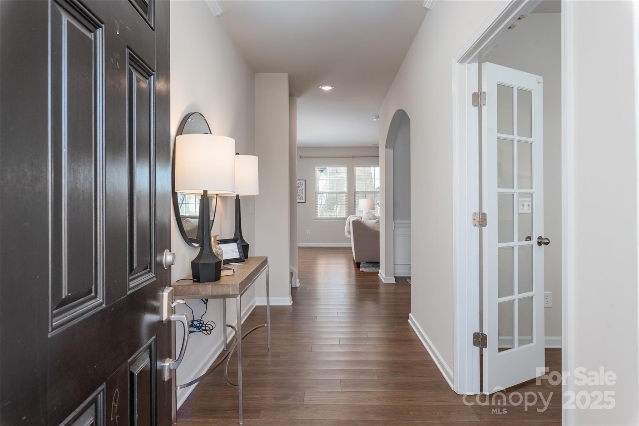 2547 Bullfrog Lane Lancaster, SC 29720 - Photo 5 of 47 a view of a hallway with wooden floor windows and a livingroom view