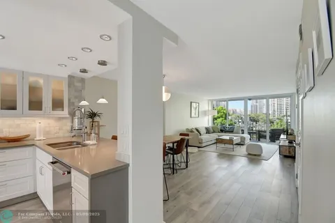 a view of a living room and dining room