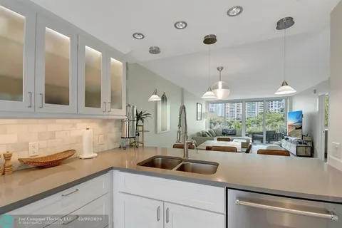a kitchen with lots of counter top space and a sink