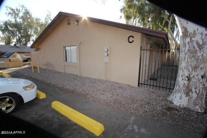 936 West Mountain View Road, Unit 14 Phoenix, AZ 85021 - Photo 2 of 10 a view of backyard with car parked
