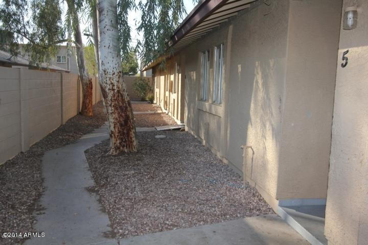 936 West Mountain View Road, Unit 14 Phoenix, AZ 85021 - Photo 7 of 10 a view of a house with a yard