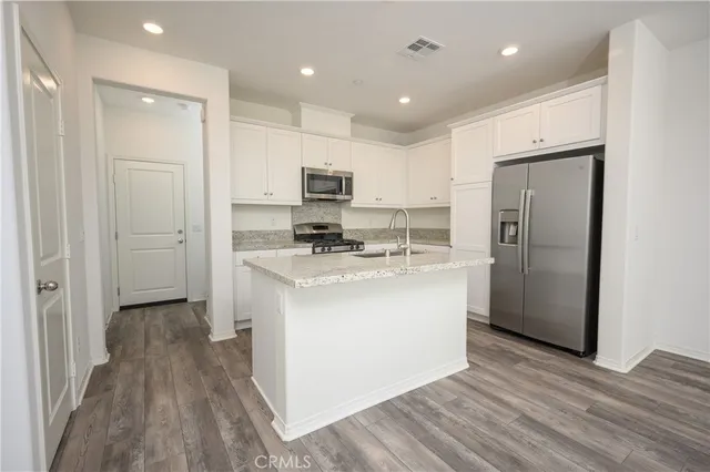 a view of kitchen with wooden floor